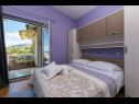 Apartmanok Palmina - comfort apartment: A1 veliki (6),  A2 žuti (4+1), A3 lila (2), SA4 bijeli (2) Makarska - Riviera Makarska  - Apartman -  A2 žuti (4+1): hálószoba